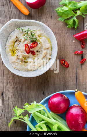 Cannellini beans dip with baby carrot,celery and radish Stock Photo