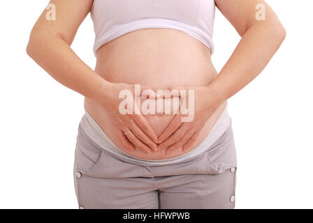 Pregnant woman clasped her hands in the shape of a heart on white background Stock Photo