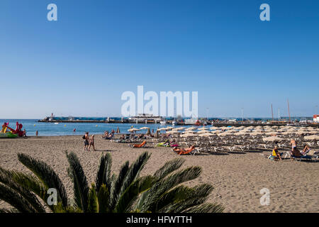 Los Cristianos promenade alongside the beach and port, Tenerife, Canary Islands, Spain Stock Photo