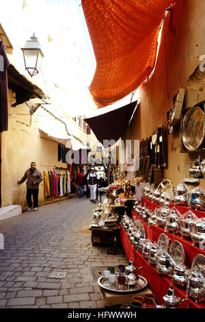 Silver teapots for sale in the narrow streets of Fez medina, Morocco.