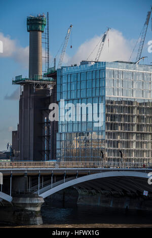A new chimney rises over Battersea power station, next to other developments. Stock Photo