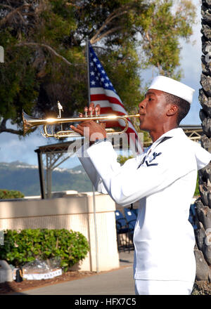 090406-N-5476H-157  HONOLULU, Hawaii (April 6, 2009) Musician 3rd Class Anthony Chiles plays Taps during a memorial ceremony April 6 at the National Memorial Cemetery of the Pacific. The ceremony commemorated the 67th Philippine national holiday “Araw ng Kagitingan”  or “Day of Valor,” and honored Filipino-American service members during World War II. (U.S. Navy photo by Mass Communication Specialist 1st Class Michael Hight/Released) US Navy 090406-N-5476H-157 Musician 3rd Class Anthony Chiles plays Taps during a memorial ceremony Stock Photo