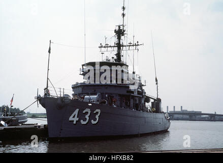 A port bow view of the ocean minesweeper USS ENGAGE  (MSO-433) moored at Pier #3 during a port visit to the Washington Navy Yard.  The ENGAGE is part of Mine Group 2 of the Naval Reserve Force. USS Engage (MSO-433) Stock Photo