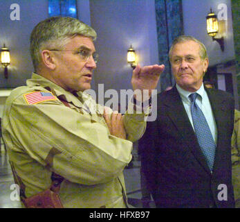 050727-N-2899A-001 Baghdad, Iraq (July 27, 2005) - Commander of Multinational Force Iraq, U.S. Army Gen. George Casey and Secretary of Defense Donald Rumsfeld answer questions during a press conference at the U.S. Embassy in Baghdad, Iraq. Gen. Casey spoke about the withdraw of U.S. forces from Iraq could take place next spring or summer if the insurgency doesn't grow. U.S. Navy photo by Lt. Cmdr Scott M. Allen (RELEASED) US Navy 050727-N-2899A-001 Commander of Multinational Force Iraq, U.S. Army Gen. George Casey and Secretary of Defense Donald Rumsfeld answer questions during a press confere Stock Photo