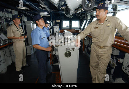 050812-F-4883S-093 Pacific Ocean (Aug. 12, 2005) - U.S. Navy Lt. Grant Hartfield, right, stands on the bridge of the Peruvian frigate BAP Villavicencio (FM 52) as he serves as a liaison officer during PANAMAX 2005. Lt. Hartfield is the Combat Systems Officer assigned to the guided missile cruiser USS Thomas S. Gates (CG 51). PANAMAX is a multinational training exercise in defense of the Panama Canal involving 15 countries. The Panama Canal is critical to the free flow of trade and goods in the Western Hemisphere and the entire world. U.S. Air Force photo by Tech. Sgt. Rick Sforza (RELEASED) US Stock Photo