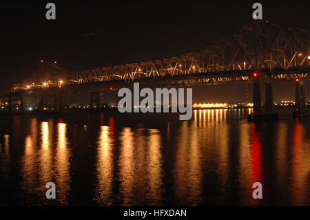 050908-N-4781D-006 New Orleans, La. (Sept. 8, 2005) Ð View of the Greater New Orleans (GNO) bridge over the Mississippi River, as seen from the flight deck of the amphibious assault ship USS Iwo Jima (LHD 7).  City lights show progressively improving power and utility services in the city of New Orleans. Iwo Jima home ported in Norfolk, Va., is providing needed humanitarian assistance to victims of Hurricane Katrina.  The Navy's involvement in the humanitarian assistance operations are being led by the Federal Emergency Management Agency (FEMA), in conjunction with the Department of Defense.   Stock Photo