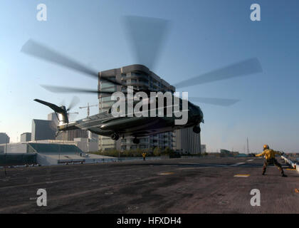 050911-N-8933S-001 New Orleans (Sept. 11, 2005) - A CH-53E Super Stallion helicopter, assigned to Marine Helicopter Squadron One (HMX-1), lands on the flight deck of the amphibious assault ship USS Iwo Jima (LHD 7) before President George W. Bush arrives aboard the ship. President Bush is visiting New Orleans and Iwo Jima to observe first hand the results of the rescue and recovery missions. Iwo Jima is currently pier side in New Orleans, assisting in Joint Task Force Katrina hurricane relief efforts to bring much needed supplies and help to Gulf Coast region. The Navy's involvement in the hum Stock Photo