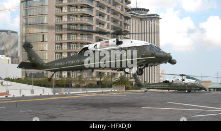 050912-N-8933S-011 New Orleans (Sept. 12, 2005) Ð U.S. Presidential Helicopter, Marine One, takes off from the flight deck aboard the amphibious assault ship USS Iwo Jima (LHD 7) after a visit from President George W. Bush. Bush visited the Iwo Jima to receive a briefing on the status of Joint Task Force Hurricane Katrina relief efforts and meet Sailors who were forward deployed to the region. The Navy's involvement in the Hurricane Katrina humanitarian assistance operations are led by the Federal Emergency Management Agency (FEMA), in conjunction with the Department of Defense. U.S. Navy phot Stock Photo