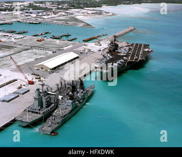 An aerial view of the aircraft carrier USS SARATOGA (CV 60), the guided missile destroyer USS SCOTT (DDG 995), and the fleet oiler USS MONONGAHELA (AO 178) tied up at pier.  This is the first time an aircraft carrier has visited the island. USS Saratoga (CV-60), USS Scott (DDG-995) and USS Monongahela (AO-178) at Diego Garcia on 16 December 1985 Stock Photo