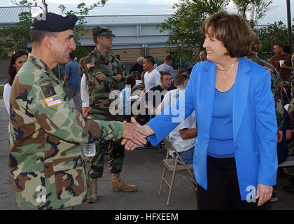 051008-N-8253M-001 New Orleans (Oct. 8, 2005) - Louisiana State Governor Kathleen Blanco shakes hands with U.S. Army Maj. Mike Costanza during a dinner with Former President George H. Bush. Bush is visiting Naval Air Station Joint Reserve Base, New Orleans personnel before receiving briefs on the status of Joint Task Force Katrina relief efforts. The Navy's involvement in humanitarian assistance operations are led by the Federal Emergency Management Agency (FEMA), in conjunction with the Department of Defense. U.S. Navy photo by Photographer's Mate 2nd Class Dawn C. Morrison (RELEASED) US Navy Stock Photo
