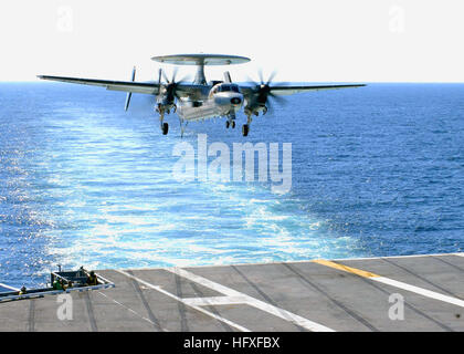 051027-N-1063M-003 Atlantic Ocean (Oct. 27, 2005) - An E-2C Hawkeye, assigned to the 'Bluetails' of Carrier Airborne Early Warning Squadron One Two One (VAW-121), prepares to land aboard the Nimitz-class aircraft carrier USS Dwight D. Eisenhower (CVN 69) during Flight Deck Certification. The certification is a critical inspection that will allow Eisenhower to demonstrate her flight deck is ready to launch, recover, refuel and handle aircraft. U.S. Navy photo by PhotographerÕs Mate Airman Dale Miller (RELEASED) US Navy 051027-N-1063M-003 An E-2C Hawkeye, assigned to the Bluetails of Carrier Air Stock Photo