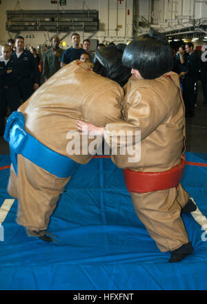 Atlantic Ocean (Nov. 5, 2006) - Sailors on board the amphibious assault ship USS Wasp (LHD 1) take part in a sumo-wrestling match during a steel beach picnic. Wasp is currently in transit on her way to homeport Norfolk, Va., after completing a humanitarian mission in support of Joint Task Force Lebanon. U.S. Navy photo by Mass Communication Specialist 3rd Class Sarah West (RELEASED) US Navy 061105-N-0730W-041 Sailors on board the amphibious assault ship USS Wasp (LHD 1) take part in a sumo-wrestling match during a steel beach picnic Stock Photo