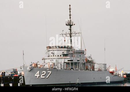 A port bow view of the ocean minesweeper USS CONSTANT (MSO 427) tied up at a pier on the base. USS Constant (AM-427) Stock Photo