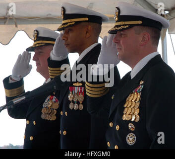 051202-N-6639M-005 Norfolk, Va. (Dec. 2, 2005) - From left, Rear Adm. Garry Hall, Capt. Edward Barfield and Capt. Robert Bougher render honors during the National Anthem before the Commander Amphibious Squadron Eight change of command. The ceremony took place aboard the dock landing ship USS Ashland (LSD 48), homeported on board Naval Amphibious Base Little Creek, Va.; Bougher relieved Barfield as Commodore of Commander Amphibious Squadron Eight.  U.S. Navy photo by Photographer's Mate 3rd Class Laura A. Moore (RELEASED) US Navy 051202-N-6639M-005 From left, Rear Adm. Garry Hall, Capt. Edward  Stock Photo
