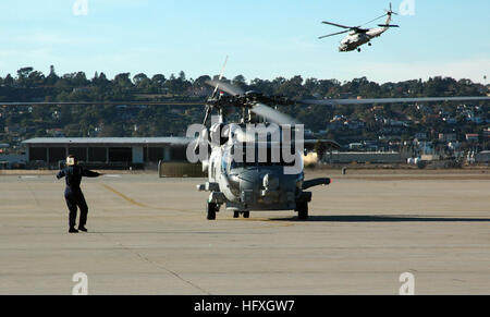 051205-N-1658A-001 San Diego (Dec. 5, 2005) - An MH-60R Seahawk, assigned to the ÒSeahawksÓ of Helicopter Anti-Submarine Squadron Light Four One (HSL-41), taxis to its flightline on board Naval Air Station North Island. The MH-60R Seahawk is the Navy's newest version of the H-60 helicopter series and will replace the SH-60B and SH-60F models. The aircraft is enhanced with a new Lockheed Martin glass cockpit, as well as mission improvements that include the sonar, radar, electronic support measures and an integrated self-defense suite. U.S. Navy photo by Journalist 1st Class Ahron Arendes (RELE Stock Photo