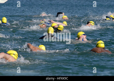 060209-N-9698C-029  Point Loma, Calif. (Feb. 9, 2006) - Sailors and civilians swim out into San Diego Bay during the 12th Annual Polar Bear Swim sponsored by Morale, Welfare and Recreation (MWR), Naval Submarine Base Point Loma. Swimmers dove into the frigid waters of San Diego bay and swam 500 meters from shore to buoys in hope of being the ÒPolar Bear King.Ó US Navy photo by PhotographerÕs Mate Airman John Ciccarelli Jr. (RELEASED) US Navy 060209-N-9698C-029 Sailors and civilians swim out into San Diego Bay during the 12th Annual Polar Bear Swim sponsored by Morale, Welfare and Recreation (M Stock Photo