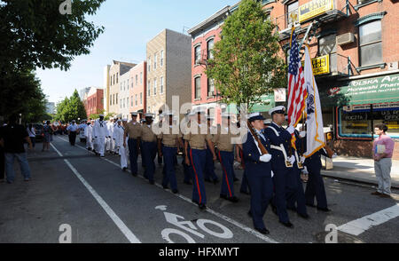 100530-N-6676S-020 NEW YORK (May 30, 2010) Coast Guard Sector New York (SECNY) Staten Island color guard members lead Marines and Sailors through a downtown section of Greenpoint, Brooklyn, for the 10th annual Greenpoint Veteran's Day parade. Approximately 3,000 Sailors, Marines and Coast Guardsmen are participating in the 23rd Fleet Week New York, which is taking place through June 2. Fleet Week has been New York City's celebration of the sea services since 1984. (U.S. Navy photo by Mass Communication Specialist 2nd Class John Stratton/Released) US Navy 100530-N-6676S-020 Coast Guard Sector N Stock Photo