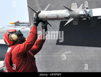 090824-N-6233H-023  PACIFIC OCEAN (Aug. 24, 2009) Aviation Ordnanceman 3rd Class Clarence Young inspects an AIM-9X Sidewinder missile before the launch of an F/A-18F Super Hornet from the Diamondbacks of Strike Fighter Squadron (VFA) 102 aboard the aircraft carrier USS George Washington (CVN 73).  George Washington is the Navy’s only permanently forward deployed aircraft carrier and is underway supporting security and stability in the western Pacific Ocean on her inaugural summer deployment from Fleet Activities Yokosuka, Japan. (U.S. Navy photo by Mass Communication Specialist Seaman Apprenti Stock Photo