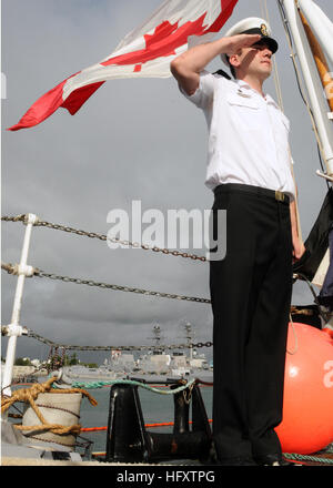 100701-N-8539M-013 PEARL HARBOR (July 1, 2010) Leading Seaman Richard Glasbergen, from Grimsby, Ontario, raises the Canadian flag aboard the Royal Canadian Navy destroyer HMCS Algonquin (DDG 283) during the morning colors ceremony for Canada Day. Algonquin is in port at Joint Base Pearl Harbor-Hickam to participate in Rim of the Pacific (RIMPAC) exercises. RIMPAC is a biennial, multinational exercise designed to strengthen regional partnerships and improve multinational interoperability. (U.S. Navy Photo by Mass Communication Specialist 2nd Class N. Brett Morton/Released) US Navy 100701-N-8539 Stock Photo