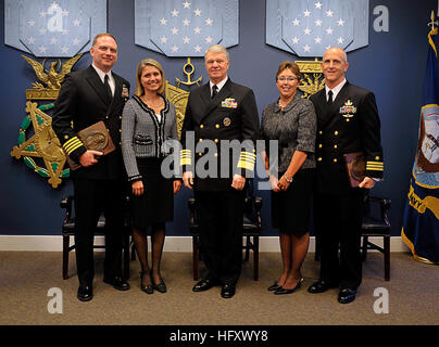 091103-N-8273J-028 WASHINGTON (Nov. 3, 2009) Chief of Naval Operations (CNO) Adm. Gary Roughead, middle, poses for a photo with Capt. William J. Parker, left, and Cmdr. Robert A. Baughman, recipients of the Vice Adm. James B. Stockdale Leadership Award, during a ceremony in the Hall of Heroes at the Pentagon. The Stockdale Awards recognize two commissioned officers on active duty below the grade of captain in command of a single ship, submarine or aviation at the time of nomination. (U.S. Navy photo by Mass Communication Specialist 1st Class Tiffini Jones Vanderwyst/Released) US Navy 091103-N- Stock Photo