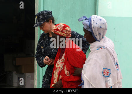 100419-M-0000T-002  NOTO GOUREY DIAME, Senegal (April 19, 2010) Lt. Cmdr. Karen Corson, medical liaison officer for Africa Partnership Station (APS) West, escorts a Senegalese woman during a medical outreach project. The 16-member team of U.S. Navy and Air Force medical and dental professionals, have treated more than 2,000 patients in a four-day period. APS West is an international initiative developed by U.S. Naval Forces Europe-Africa that aims to improve maritime safety and security in Africa. (U.S. Marine Corps photo by 2nd Lt. Nicole P. Teat/Released) US Navy 100419-M-0000T-002 Lt. Cmdr. Stock Photo