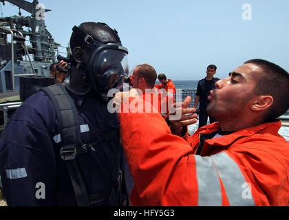 100419-N-6138K-714  ATLANTIC OCEAN (April 19, 2010) Spanish navy sailor Marinero Tomas Yanes helps Togolese navy Chief Petty Officer Kpomgbe Kouessan operate a self-contained breathing apparatus aboard the Spanish navy Servola-class offshore patrol vessel SPS Centinela (P 72), during a flight deck drill as part of Africa Partnership Station (APS) West. The drill was part of a cross deck training exercise with ships from Spain, Senegal, and the United States. Gunston Hall is on a scheduled deployment in West and Central Africa in support of APS West, an international initiative developed by U.S Stock Photo