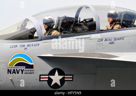 Navy pilots conduct a supersonic flight test in an F/A-18 Green Hornet at Naval Air Station Patuxent River using a 50/50 biofuel blend, supporting research and development of alternative fuels. Stock Photo