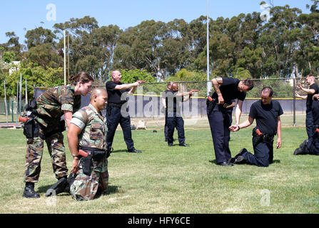 100506-N-8824M-026 SAN DIEGO (May 6, 2010) Navy law enforcement members participate in apprehension techniques during the Navy Security Forces Training Course at Naval Air Station North Island. The pilot program simultaneously trains civilian and military police forces during a nine-week course, which enables the different law enforcement agencies to successfully work together during operations. (U.S. Navy photo by Mass Communication Specialist 3rd Class Spencer Mickler/Released) US Navy 100506-N-8824M-026 Navy law enforcement members participate in apprehension techniques during the Navy Secu Stock Photo
