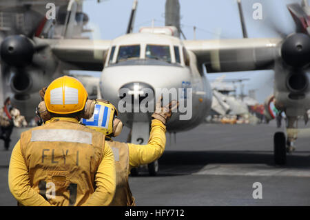 100518-N-4236E-056 ARABIAN SEA (May 18, 2010) Aviation Boatswain's Mate (Handling) 2nd Class Bryant Simms and Aviation Boatswain's Mate (Handling) Airman Antoinette Corona direct an E-2C Hawkeye assigned to the Bluetails of Airborne Early Warning Squadron (VAW) 121 to a catapult aboard the aircraft carrier USS Dwight D. Eisenhower (CVN 69). The Eisenhower Carrier Strike Group is deployed as part of an ongoing rotation of forward-deployed forces to support maritime security operations in the U.S. 5th Fleet area of responsibility. (U.S. Navy photo by Mass Communication Specialist 3rd Class Chad  Stock Photo