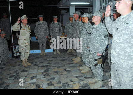 Kabul, Afghanistan - Vice Adm. Bill Gortney, left, Commander, U.S. Navy Forces Central Command/5th Fleet, administers the oath to Sailors during a frocking ceremony on Camp Eggers. During his visit to Camp Eggers, the headquarters of NATO Training Mission - Afghanistan, Gortney met with command staff, officiated at a frocking ceremony for six Sailors and spoke openly to Sailors about the importance of their mission in Afghanistan.(US Navy Photo by Chief Mass Communication Specialist F. Julian Carroll)RELEASED Vice Adm. Bill Gortney visits Sailors at NTM-A in Afghanistan (4678485789) Stock Photo