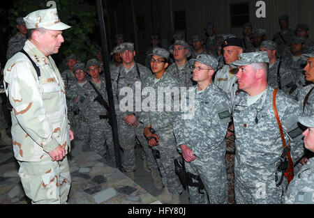 Kabul, Afghanistan - Vice Adm. Bill Gortney, left, Commander, U.S. Navy Forces Central Command/5th Fleet, ponders a question raised by a Sailor during a question and answer session on Camp Eggers. During his visit to Camp Eggers, the headquarters of NATO Training Mission - Afghanistan, Gortney met with command staff, officiated at a frocking ceremony for six Sailors and spoke openly to Sailors about the importance of their mission in Afghanistan.(US Navy Photo by Chief Mass Communication Specialist F. Julian Carroll)RELEASED Vice Adm. Bill Gortney visits Sailors at NTM-A in Afghanistan (467911 Stock Photo