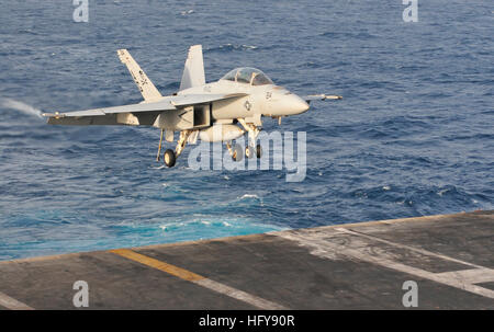 100621-N-3595W-001 ARABIAN SEA (June 21, 2010) An F/A-18F Super Hornet assigned to the Jolly Rogers of Strike Fighter Squadron (VFA) 103, lands aboard the aircraft carrier USS Dwight D. Eisenhower (CVN 69). The Eisenhower Carrier Strike Group is deployed as part of an ongoing rotation of forward-deployed forces to support maritime security operations in the U.S. 5th Fleet area of responsibility. (U.S. Navy photo by Mass Communication Specialist 2nd Class Gina K. Wollman/Released) US Navy 100621-N-3595W-001 An F-A-18F Super Hornet assigned to the Jolly Rogers of Strike Fighter Squadron (VFA) 10 Stock Photo