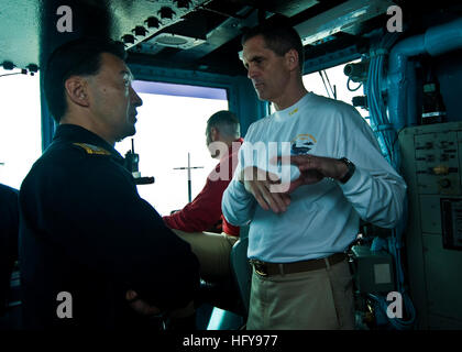 100624-N-4830B-082 PACIFIC OCEAN (June 24, 2010) Capt. David Lausman, commanding officer of the aircraft carrier USS George Washington (CVN 73), explains emergency breakaway procedures to Japan Maritime Self-Defense Force Rear Adm. Umio Otsuka, commander of Escort Flotilla 2, during a replenishment at sea with the Military Sealift Command fleet replenishment oiler USNS Tippecanoe (T-AO-199). George Washington, the Navy's only permanently forward-deployed aircraft carrier, is participating in Undersea Warfare Exercise (USWEX), an annual bilateral exercise involving the Japan Maritime Self-Defen Stock Photo