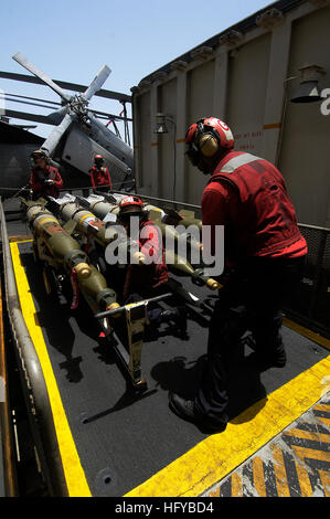 100804-N-4135M-097 U.S. 5TH FLEET AREA OF RESPONSIBILITY (Aug. 4, 2010) Aviation Ordnancemen aboard the aircraft carrier USS Harry S. Truman (CVN 75) move bombs from the ordnance elevator onto the flight deck. The Harry S. Truman Carrier Strike Group is deployed supporting maritime security operations and theater security cooperation efforts in the U.S. 5th Fleet area of responsibility. (U.S. Navy photo by Mass Communication Specialist 3rd Class Zachary D. Montgomery/Released) US Navy 100804-N-4135M-097 Aviation Ordnancemen aboard the aircraft carrier USS Harry S. Truman (CVN 75) move bombs fr Stock Photo