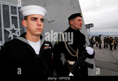 100907-N-7638K-018 MURMANSK, Russia (Sept. 7, 2010) Yeoman 3rd Class Jeremy Tenney, from Lexington, Md., a member of the Oliver Hazard Perry-class guided-missile frigate USS Taylor (FFG 50) color guard, stands at attention alongside sailors from the Russian Armed Forces during a wreath laying ceremony at the Alyosha World War II Monument to honor fallen soldiers from World War II. Taylor is in Murmansk participating in several commemorative events marking the 65th anniversary of the end of world War II. Taylor is on a scheduled deployment in the U.S. 6th Fleet area of responsibility. (U.S. Nav Stock Photo