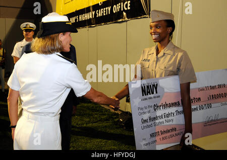100911-N-4995K-071 MEMPHIS, Tenn. (Sept. 11, 2010) Rear Adm. Robin Graf, deputy commander of Navy Recruiting Command, shakes hands with Midshipmen Chrishanna Edgeston after presenting her with a Naval ROTC scholarship check during the 21st Southern Heritage Classic football game at Liberty Stadium. Sailors from across Navy Recruiting District Nashville attended multiple events during the Southern Heritage Classic cultural celebration to foster diversity in recruiting throughout the region.  (U.S. Navy photo by Mass Communication Specialist 2nd Class Chelsea Kennedy/Released) US Navy 100911-N-4 Stock Photo