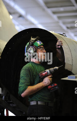 101008-N-3793B-039 ARABIAN SEA (Oct. 8, 2010) Aviation Structural Mechanic 3rd Class Joseph Morton, from Kansas City, Kan., assigned to the Ragin' Bulls of Strike Fighter Squadron (VFA) 37, conducts maintenance the variable diameter exhaust nozzle fairing on an F/A-18C Hornet. VFA-37 is deployed as part of the Harry S. Truman Carrier Strike Group in support of maritime security operations and theater security cooperation efforts in the U.S. 5th Fleet area of responsibility. (U.S. Navy photo by Mass Communication Specialist 3rd Class Marie Brindovas/Released) US Navy 101008-N-3793B-039 Aviation Stock Photo