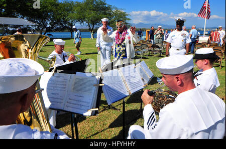 A USS Nevada survivor directs the Pacific Fleet Band during the 69th USS Nevada commemoration ceremony in Hawaii. Survivors from the attack on Pearl Harbor are currently in Hawaii for various ceremonies being held to honor those fallen on Dec. 7,1941. USS Pearl Harbor on hand to remember Pearl Harbor DVIDS348050 Stock Photo