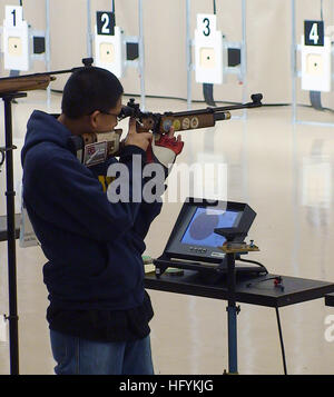 110212-N-FO977-357 ANNISTON, Ala. (Feb. 12, 2011) Navy Junior Reserve Officers Training Corps (NJROTC) cadet and sporter division individual champion, Renz Ibarra, a senior attending Zion-Benton High School in Zion, Ill., sets his sights on the target during the 2011 NJROTC Air Rifle Championship in Anniston, Ala. Approximately 200 NJROTC cadets from 51 high schools across the United States participated in the competition. (U.S. Navy photo by Mike Miller/Released) US Navy 110212-N-FO977-357 Navy Junior Reserve Officers Training Corps cadet and sporter division individual champion, Renz Ibarra, Stock Photo