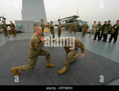 110223-N-5086M-125 HONG KONG (Feb. 23, 2011) Lance Cpls. Zachary Gregory and Ren Beazley, both assigned to Fleet Anti-Terrorism Security Team (FAST) Pacific, conduct a martial arts training exhibition during a professional development exchange aboard the U.S. 7th Fleet command ship USS Blue Ridge (LCC 19) with members of the Flying Tigers from the Hong Kong Police Department Special Duties Unit. Blue Ridge is conducting a spring patrol. (U.S. Navy photo by Mass Communication Specialist 1st Class Greg Mitchell/Released) US Navy 110223-N-5086M-125 Lance Cpls. Zachary Gregory and Ren Beazley, bot Stock Photo