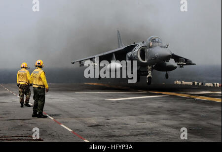 110411-N-7508R-002 ATLANTIC OCEAN (April 11, 2011) Landing signal enlisted (LSE) personnel observe as  AV-8B Harrier assigned to Marine Medium Tiltrotor Squadron (VMM) 263 (Reinforced) land aboard the multipurpose amphibious assault ship USS Bataan (LHD 5). Bataan is deploying to the Mediterranean Sea. (U.S. Navy photo by Mass Communication Specialist 2nd Class Julio Rivera/Released) US Navy 110411-N-7508R-002 Landing signal enlisted (LSE) personnel observe as AV-8B Harrier assigned to Marine Medium Tiltrotor Squadron (VMM) 263 Stock Photo