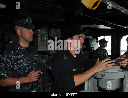 110421-N-NL541-128 SALVADOR, Brazil (April 21, 2011) Lt. j.g. Michael Schelcher, left, and Lt. j.g. Pablo Berg, from the Chilean navy, observe from the pilot house as the guided-missile frigate USS Thach (FFG 43) departs the pier at Salvador, Brazil. Thach is deployed in support of Southern Seas 2011. (U.S. Navy photo by Mass Communication Specialist 3rd Class Stuart Phillips/Released) US Navy 110421-N-NL541-128 Lt. j.g. Michael Schelcher, left, and Lt. j.g. Pablo Berg, from the Chilean navy, observe from the pilot house as the gu Stock Photo