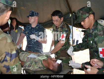 110518-N-VA590-244   HAD YAO BEACH, Thailand (May 18, 2011) Senior Chief Hospital Corpsman Tom Gilham, center left, assigned to Commander, Task Force 73, reviews triage procedures with Royal Thai Navy medical personnel during a simulated medical evacuation during an amphibious landing exercise as part of Cooperation Afloat Readiness and Training (CARAT) Thailand 2011. CARAT is a series of bilateral exercises held annually in Southeast Asia to strengthen relationships and enhance force readiness. (U.S. Navy photo by Mass Communication Specialist 1st Class Jose Lopez Jr./Released) US Navy 110518 Stock Photo