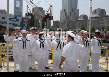 110526-N-PS473-081 NEW YORK (May 26, 2011) Rear Adm. Herman Shelanski, commander of Carrier Strike Group (CSG) 10, re-enlists 12 Sailors at Ground Zero during Fleet Week New York 2011. Fleet Week has been New York City's celebration of the sea services since 1984. It is an opportunity for citizens of New York and the surrounding tri-state area to meet Sailors, Marines, and Coast Guardsmen, as well as see first-hand, the capabilities of today's maritime services. (U.S. Navy photo by Mass Communication Specialist 2nd Class Eric S. Garst/Released) US Navy 110526-N-PS473-081 Rear Adm. Herman Shela Stock Photo
