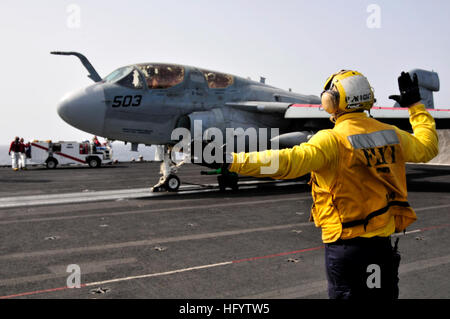 110606-N-AV746-400 ARABIAN SEA (June 6, 2011) Aviation BoatswainÕs Mate (Handling) 3rd Class Patrick Wight, from Farmersville, Ohio, signals to the pilots of an EA-6B Prowler assigned to the Cougars of Tactical Electronic Warfare Squadron (VAQ) 139 before catapulting off the flight deck of the aircraft carrier USS Ronald Reagan (CVN 76). Ronald Reagan and Carrier Air Wing (CVW) 14 are deployed to the U.S. 5th Fleet area of responsibility conducting close-air support missions as part of Operation Enduring Freedom. (U.S. Navy photo by Mass Communication Specialist Seaman Timothy Black/Released)  Stock Photo