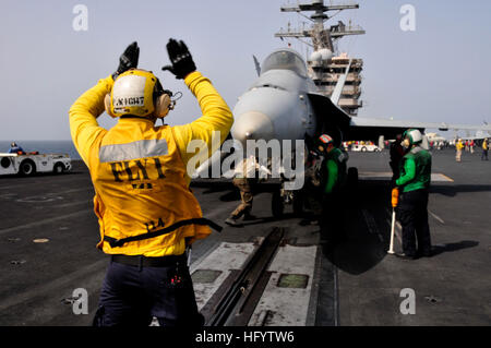 110606-N-AV746-450 ARABIAN SEA (June 6, 2011) Aviation BoatswainÕs Mate (Handling) 3rd Class Patrick Wight, from Farmersville, Ohio, signals to the pilots of an EA-6B Prowler assigned to the Cougars of Tactical Electronic Warfare Squadron (VAQ) 139 before catapulting off the flight deck of the aircraft carrier USS Ronald Reagan (CVN 76). Ronald Reagan and Carrier Air Wing (CVW) 14 are deployed to the U.S. 5th Fleet area of responsibility conducting close-air support missions as part of Operation Enduring Freedom. (U.S. Navy photo by Mass Communication Specialist Seaman Timothy Black/Released)  Stock Photo