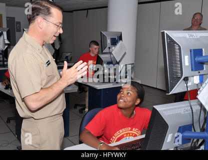 110622-N-IK959-076 NAVAL STATION GREAT LAKES, Ill. (June 22, 2011) Rear Adm. David F. Steindl, commander of Naval Service Training Command, talks to a Navy JROTC cadet ensign, a junior from North Chicago High School, during the 2011 NJROTC Leadership Academy. During the weeklong event, upcoming NJROTC juniors and seniors were trained to be the senior leaders of their units for the upcoming high school year. (U.S. Navy photo by Scott A. Thornbloom/Released) US Navy 110622-N-IK959-076 Rear Adm. David F. Steindl talks to a Navy JROTC cadet ensign during the 2011 NJROTC Leadership Academy Stock Photo