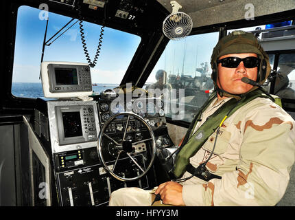 110718-N-NX238-036 SAN CLEMENTE ISLAND, Calif. (July 18, 2011) Engineman 1st Class John Demery, boat captain of a 34-foot Sea Ark Dauntless tactical craft assigned to Maritime Expeditionary Security Squadron (MSRON) 11, prepares to go underway on combat maneuvers off San Clemente Island during ULTRA 2011. ULTRA is a two-week exercise focusing on expeditionary warfare skill qualifications and battle readiness to prepare for deployments. (U.S. Navy photo by Mass Communication Specialist 2nd Class Noel L. Danseco/Released) US Navy 110718-N-NX238-036 Engineman 1st Class John Demery prepares to go  Stock Photo