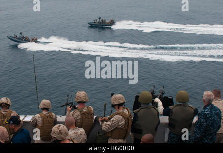 110814-N-PB383-001 PACIFIC OCEAN (Aug. 14, 2011) Sailors and Marines aboard the San Antonio-class amphibious transport dock ship USS New Orleans (LPD 18) observe Sailors operating rigid-hull inflatable boats with Marines from the 11th Marine Expeditionary Unit (11th MEU) Maritime Raid Force during a practice raid. New Orleans and embarked Marines from the 11th MEU are conducting pre-deployment work-ups as part of the Makin Island Amphibious Ready Group. (U.S. Navy photo by Mass Communication Specialist 3rd Class Dominique Pineiro/Released) US Navy 110814-N-PB383-001 Sailors and Marines aboard  Stock Photo