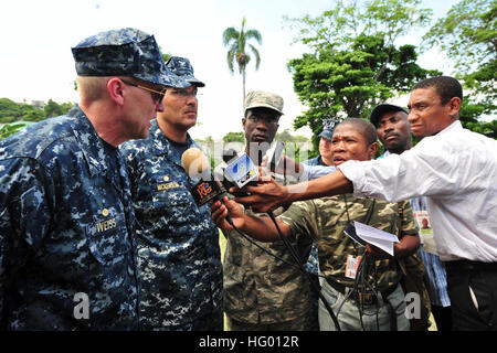 110826-F-NJ219-128 PORT-AU-PRINCE, Haiti (Aug. 26, 2011) Capt. David Weiss, commanding officer of the Military Sealift Command hospital ship USNS Comfort (T-AH 20) and Commodore Brian Nickerson, Continuing Promise 2011 mission commander, answer questions for local media after the closing ceremony in Port-au-Prince, Haiti. Continuing Promise is a five-month humanitarian assistance mission to the Caribbean, Central and South America. (U.S. Air Force photo by Staff Sgt. Courtney Richardson/Released) US Navy 110826-F-NJ219-128 Capt. David Weiss and Commodore Brian Nickerson answer questions for lo Stock Photo